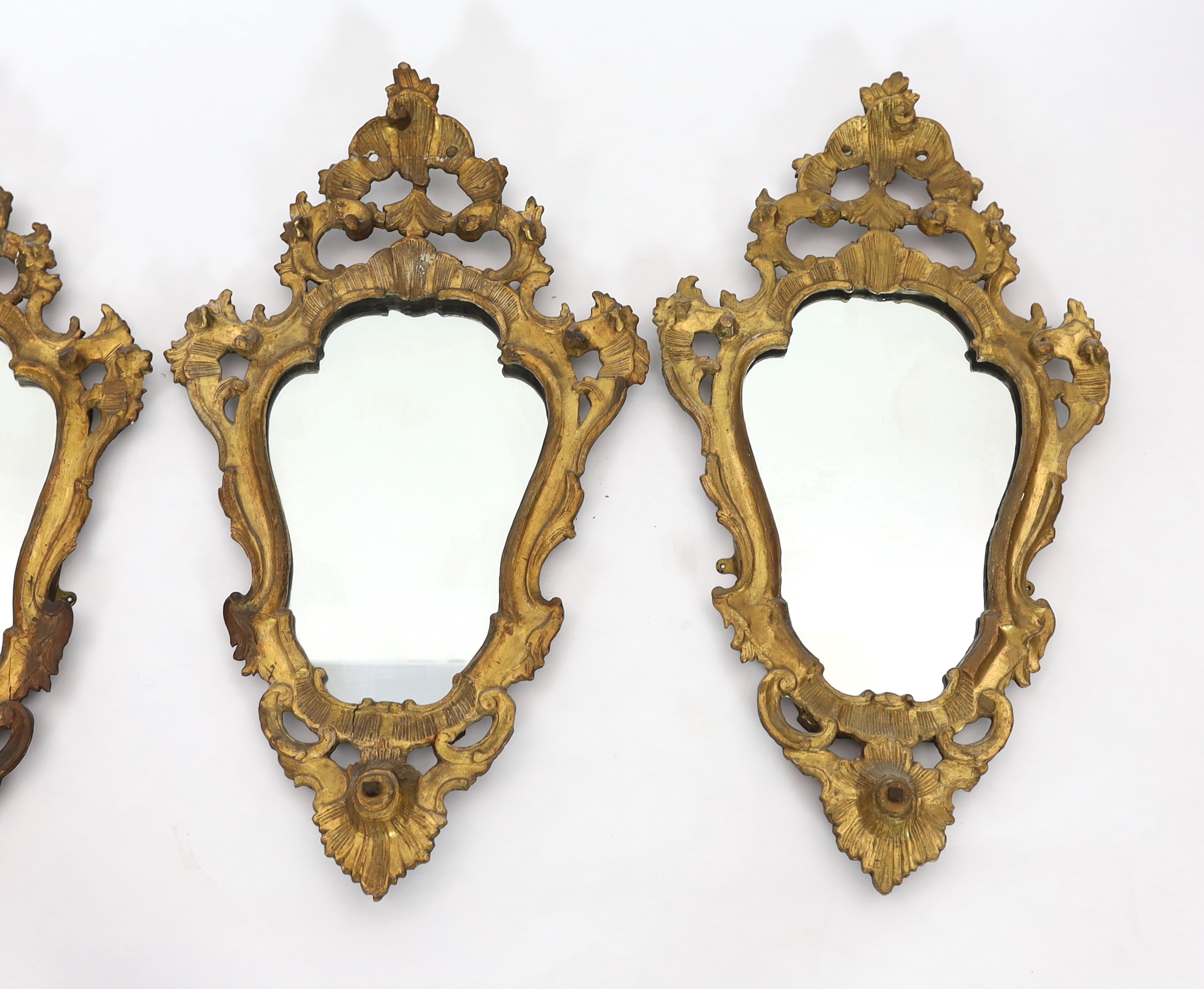 A set of four 19th century Italian giltwood wall mirrors 48cm wide, 83cm high